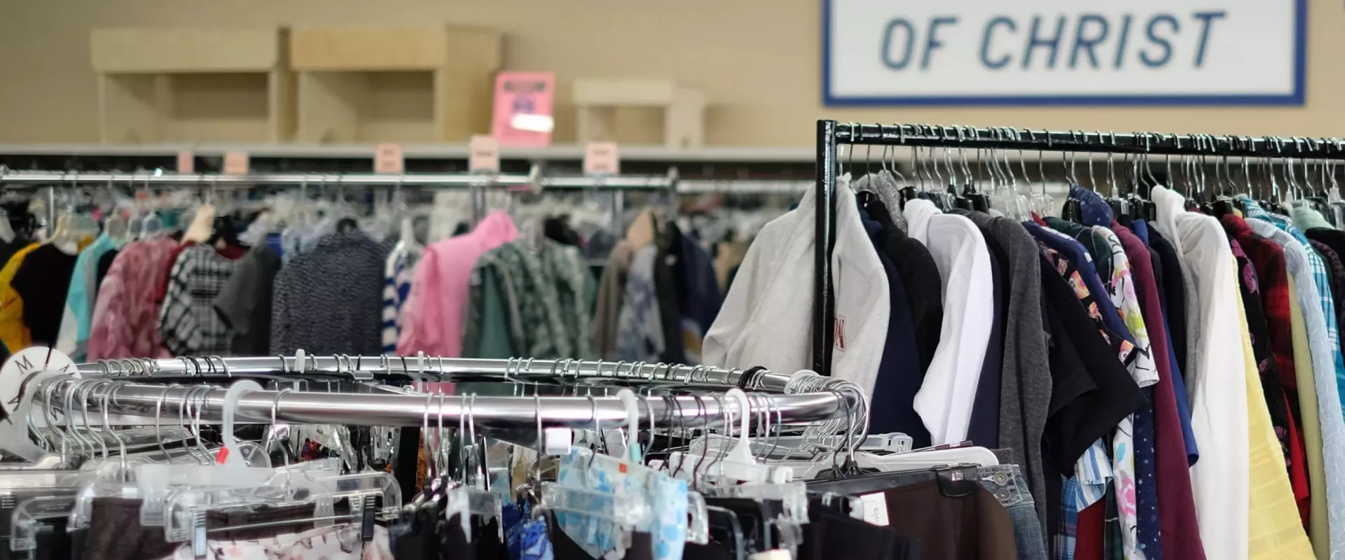 Clothes hanging on racks in the Winkler MCC Thrift shop.